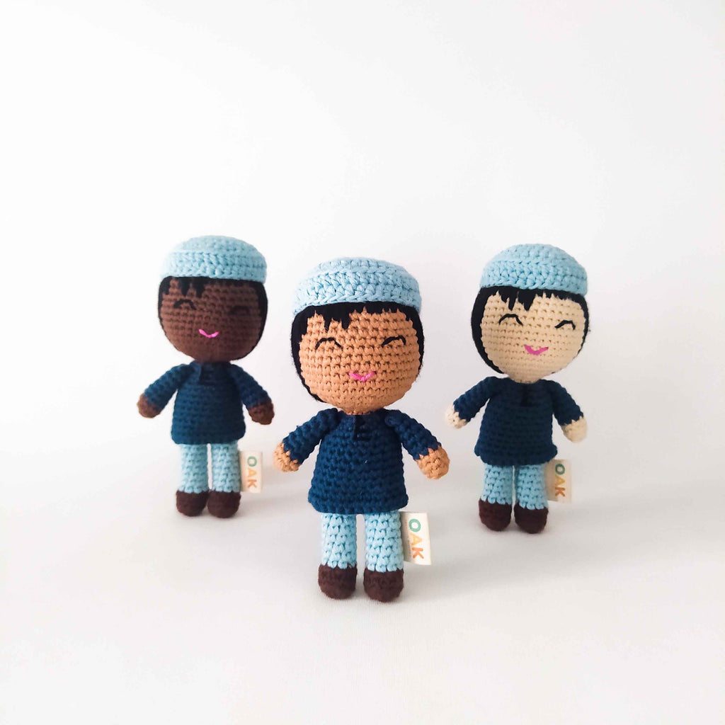 Handmade Muslim Doll with Kufi and long shirt. Three dolls include dark, medium and light skin tones. They are wearing a light blue kufi and a dark blue shirt.