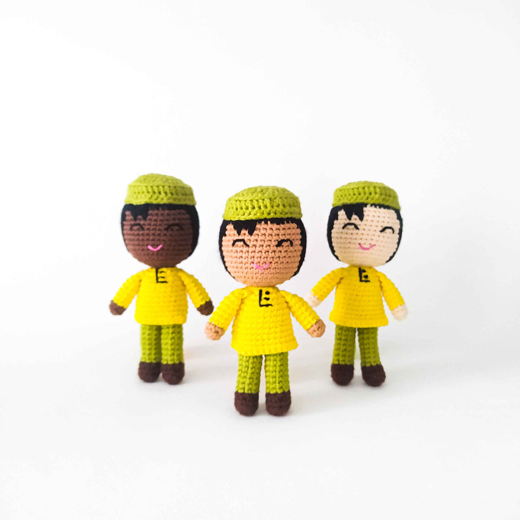 Handmade boy with kufi and long shirt. These dolls have three different skin tones and have a green kufi and, yellow shirt and green pants.